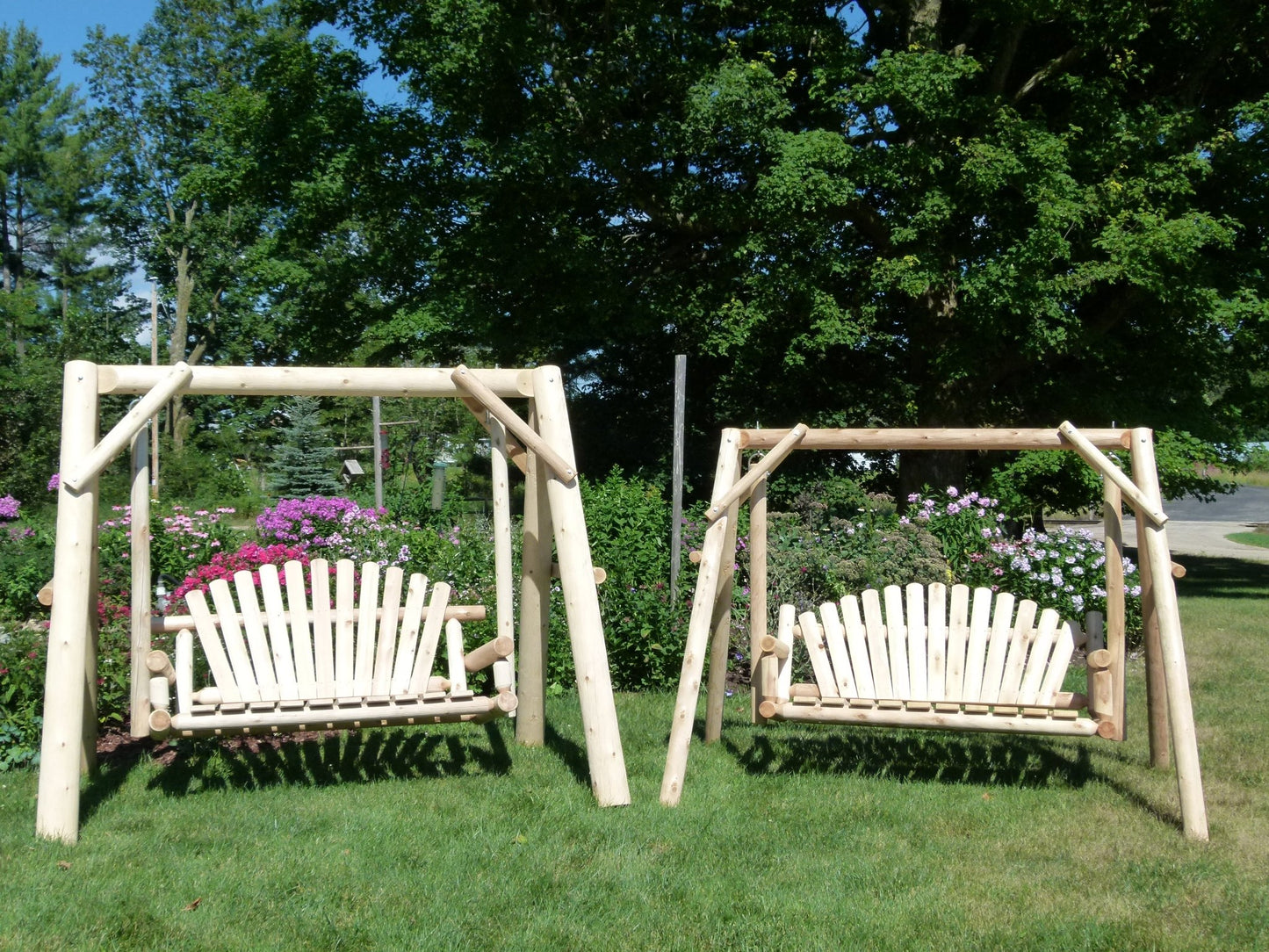 Two Handcrafted Patio Wooden Swings in a lush garden, offering rustic charm and outdoor relaxation
