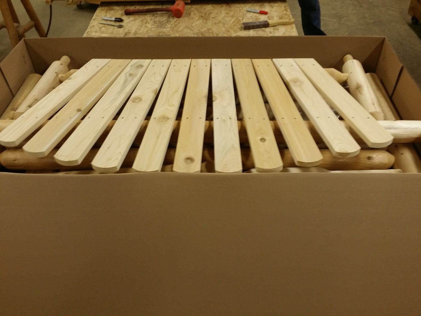 Rustic log swing seat pre-packed for convenient shipping and setup