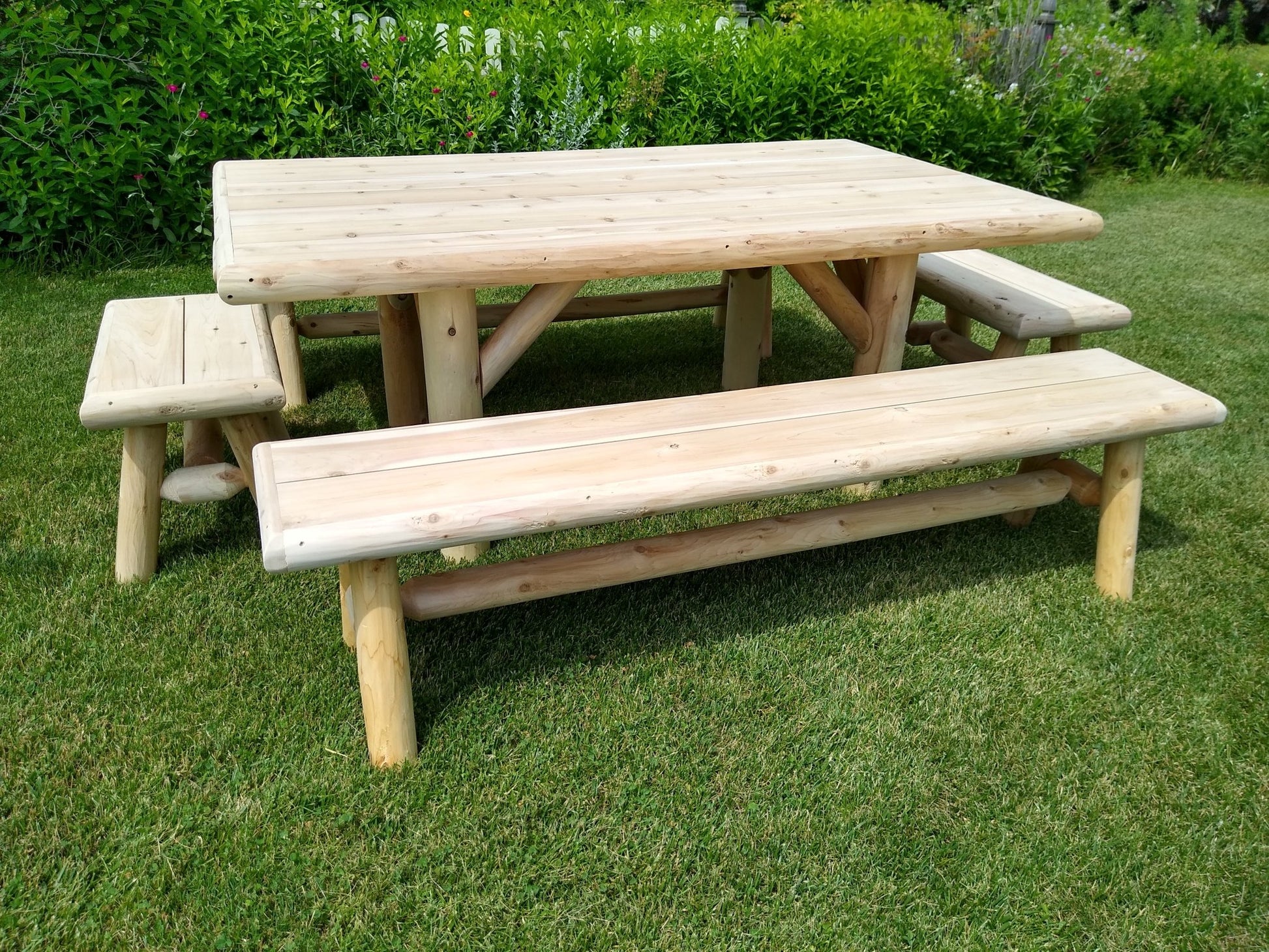 Rustic outdoor garden table with handcrafted benches, perfect for backyard gatherings and outdoor dining.