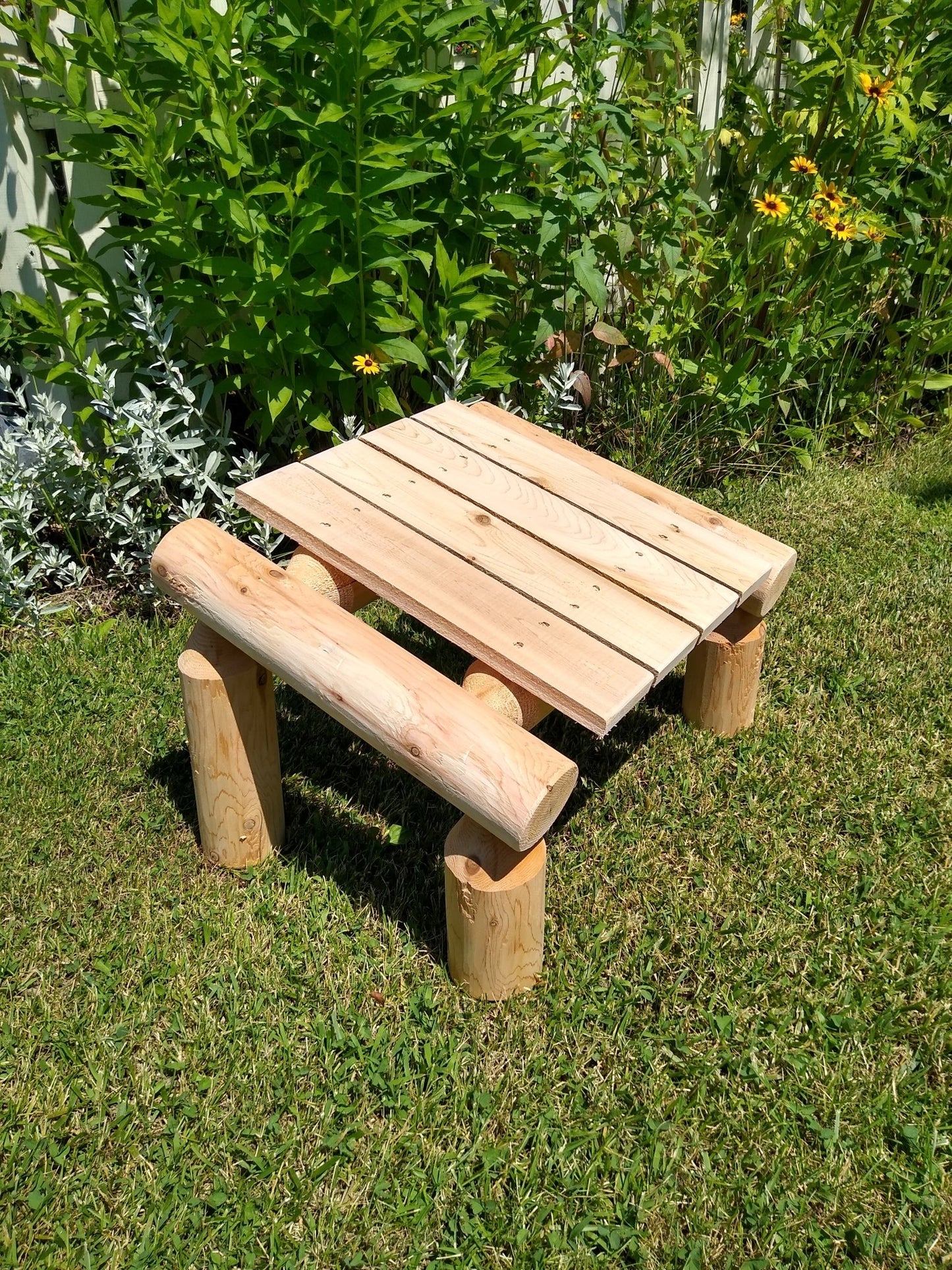Patio foot rest with a handcrafted log design, perfect for outdoor relaxation.