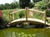 Cedar Creek Rustic Furniture manufactures 8' Custom Made Log Cedar Bridges, Garden Pond Bridges.