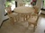 Rustic dining room table made of northern white cedar.  The top is made of dry kilned cedar lumber that is laminated together giving it a solid top.  Most rustic log dining room tables do not have a solid top.