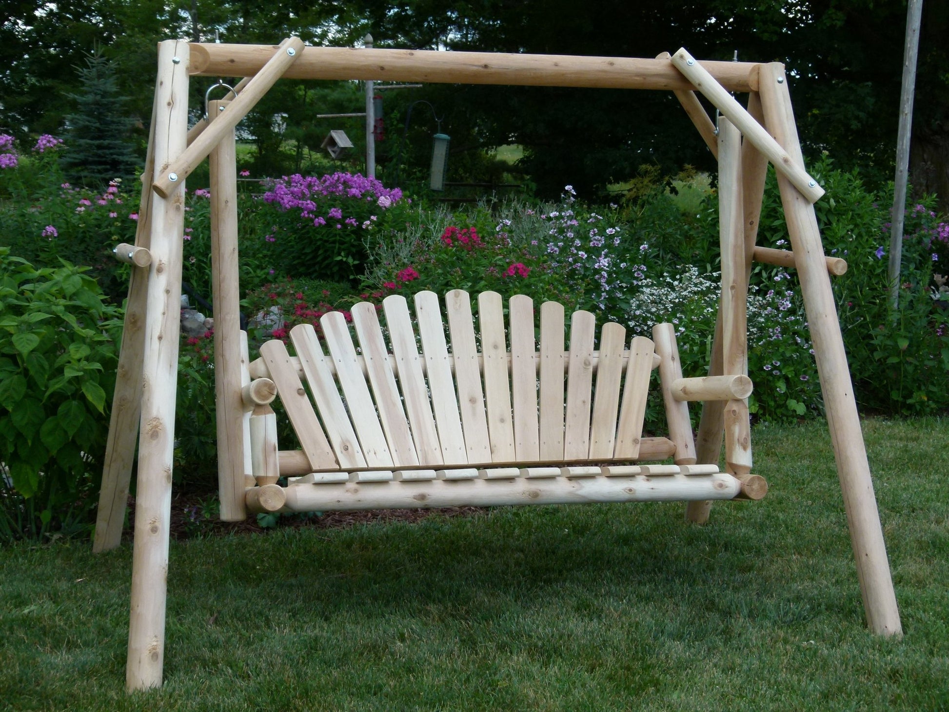 Beautiful rustic log swing designed for outdoor relaxation and garden seating