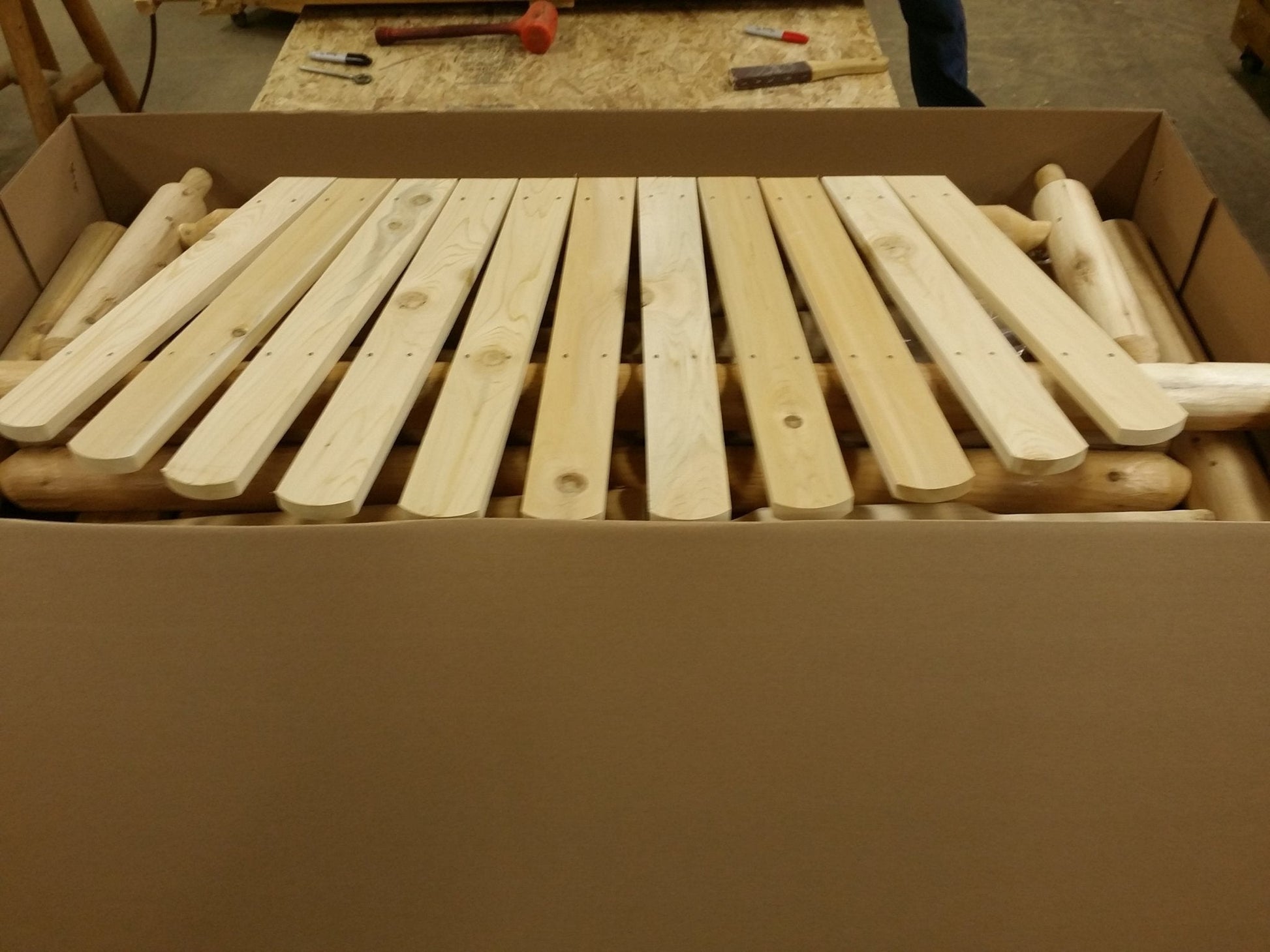 Pre-assembled parts of a front door bench outdoor, securely packed for easy shipping