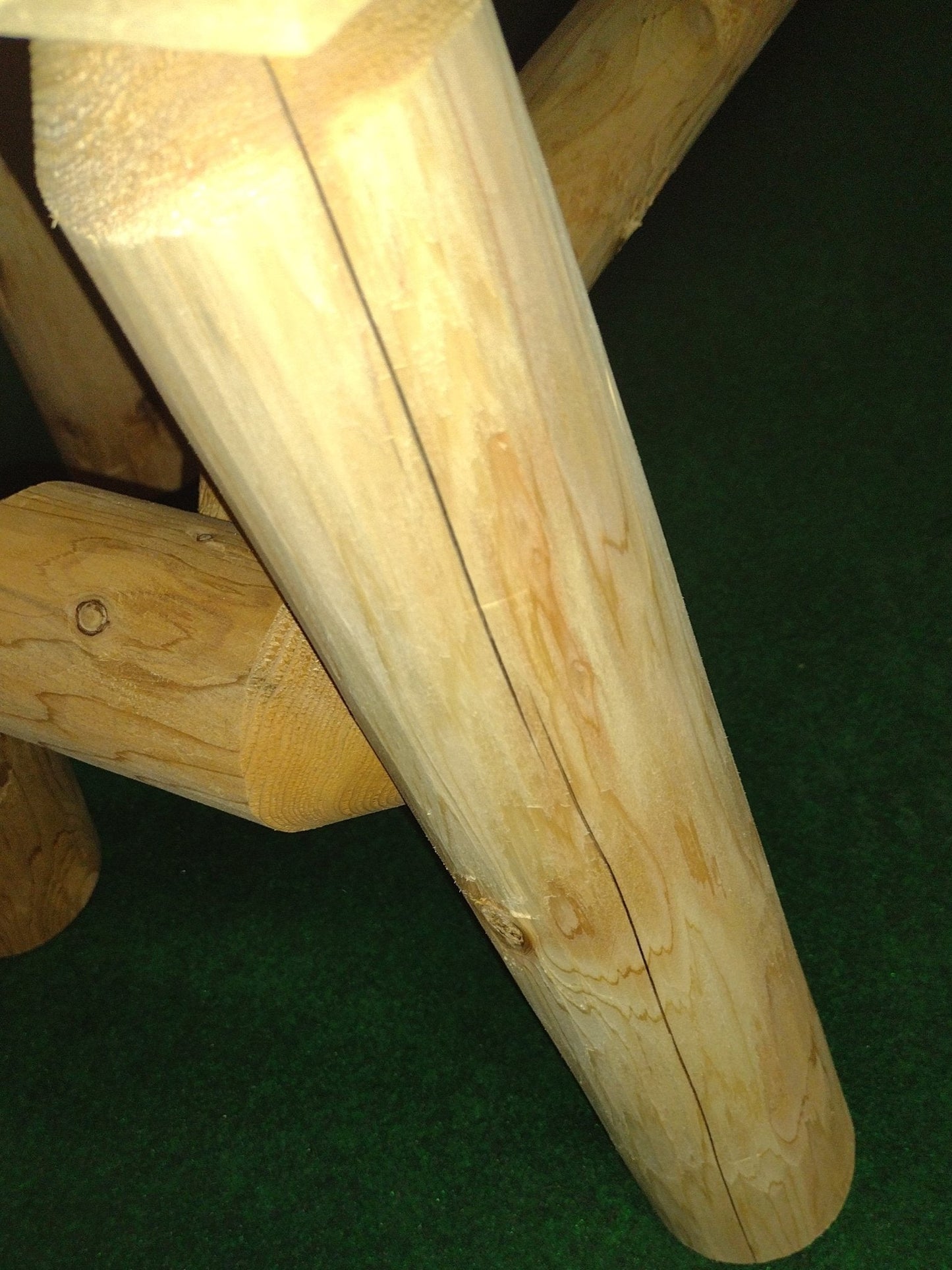 Sturdy wooden leg construction for a durable handmade wooden rocking chair.